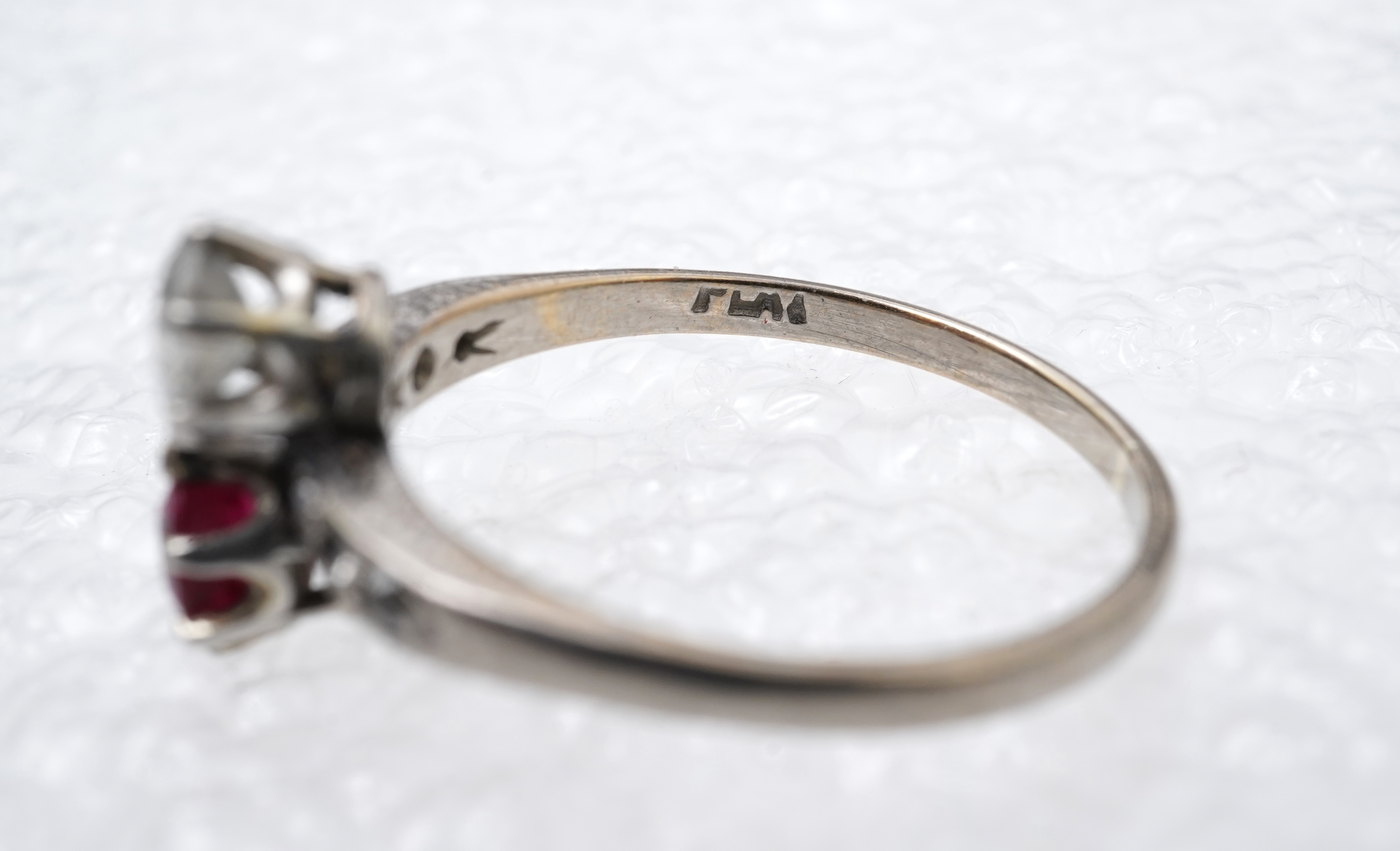 A synthetic ruby and diamond 'toi-et-moi' ring, early 20th century